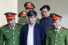 Bị cáo Nguyễn Thanh Hóa lĩnh án 10 năm tù, và Phan Văn Vĩnh lĩnh án 9 năm tù. (Ảnh: Trung Kiên/TTXVN)