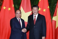 Thủ tướng Nguyễn Xuân Phúc và Tổng Bí thư, Chủ tịch Trung Quốc Tập Cận Bình. (Ảnh: Thống Nhất/TTXVN)