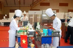 Đoàn Việt Nam tại nội dung thi nấu ăn. (Ảnh: Hoàng Nhương/Vietnam+)