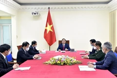 Thủ tướng Phạm Minh Chính điện đàm với Thủ tướng Quốc vụ viện Trung Quốc Lý Khắc Cường. (Ảnh: Dương Giang/TTXVN)