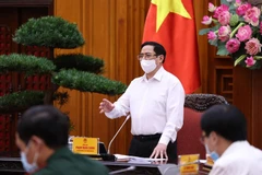 Thủ tướng Phạm Minh Chính yêu cầu thực hiện nghiêm túc các biện pháp phòng, chống dịch trong các khu công nghiệp. (Ảnh: Dương Giang/TTXVN)