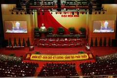 Đại hội nghe đồng chí Nguyễn Phú Trọng, Tổng Bí thư Ban Chấp hành Trung ương Đảng, Chủ tịch nước CHXHCN Việt Nam đọc Báo cáo chính trị của Ban Chấp hành Trung ương Đảng khóa XII và các văn kiện trình Đại hội. (Ảnh: TTXVN)