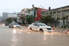 Ngập úng cục bộ do mưa lớn. (Ảnh: Hoàng Nguyên/TTXVN)