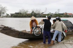 Nhiều xã ở huyện Quảng Điền bị ngập lụt sâu, trên diện rộng. (Ảnh: Đỗ Trưởng/TTXVN)