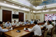 Cuộc họp giữa Thường trực Ban Chỉ đạo Thành phố Hồ Chí Minh về phòng chống dịch bệnh COVID 19. (Ảnh: Anh Tuấn/TTXVN)