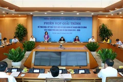 Quang cảnh phiên giải trình về thực hiện kế hoạch đầu tư công trung hạn của HĐND thành phố Hà Nội ngày 31/8. (Ảnh: TTXVN)