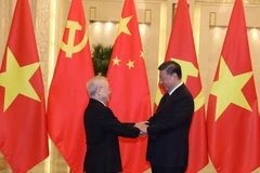 Tổng Bí thư, Chủ tịch Trung Quốc Tập Cận Bình đón Tổng Bí thư Nguyễn Phú Trọng. (Ảnh: Trí Dũng/TTXVN)