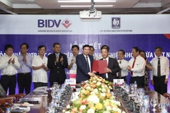 Lãnh đạo hai bên tham gia ký kết. (Nguồn: BIDV)