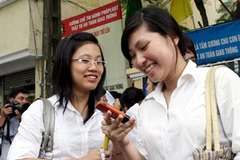 Thí sinh hớn hở vì làm bài thi tốt. (Ảnh minh họa. Trung Hiền/Vietnam+)