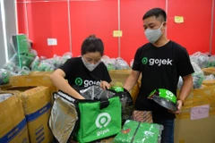 Chỉ trong 6 phút, tài xế hãng xe công nghệ GoViet trở thành Gojek. (Ảnh: PV/Vietnam+)