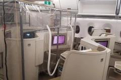 Bên trong khoang máy bay Vietnam Airlines đi đón người Việt Nam ở Guinea Xích Đạo về nước. (Ảnh: PV/Vietnam+)