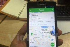 Ứng dụng phần mềm gọi xe của Grab đã hoạt động trở lại sau khi được thành phố Hà Nội cho phép sau giãn cách xã hội. (Ảnh: Việt Hùng/Vietnam+)
