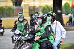 Gojek đưa ra chương trình chuyến xe đồng giá 8.000 đồng. (Ảnh: PV/Vietnam+)
