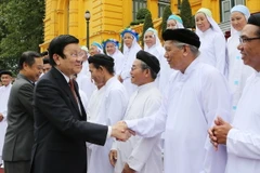Chủ tịch nước Trương Tấn Sang gặp mặt thân mật Đoàn đại biểu chức sắc lãnh đạo các Hội Thánh Cao Đài Việt Nam. (Ảnh: Nguyễn Khang/TTXVN)