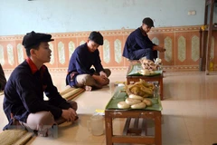 Cúng tổ tiên trong ngày đón tết năm cùng của người Dao. (Ảnh: Nguyễn Nam/TTXVN) 