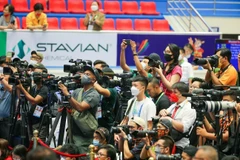 Các phóng viên trong nước và quốc tế tác nghiệp tại Đại hội Thể thao Đông Nam Á lần thứ 31 năm 2021 (SEA Games 31). (Ảnh: TTXVN) 