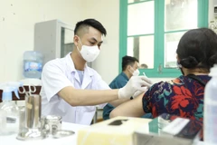 Tiêm phòng vaccine COVID-19. (Nguồn: TTXVN)