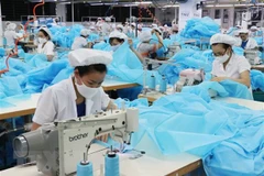 Một dây chuyền dệt may xuất khẩu. Ảnh minh họa. (Nguồn: TTXVN)