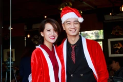 Slim V và bạn gái Huyền Trang tại buổi họp báo trình làng album hòa tấu chủ đề Giáng sinh. (Ảnh: Hồ Điệp)