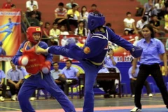 Một trận đấu trong nội dung đối kháng. (Nguồn: Duy Khương/TTXVN)