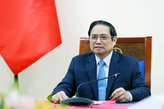 Thủ tướng Phạm Minh Chính điện đàm với Thủ tướng Italy Mario Draghi. (Ảnh: Dương Giang/TTXVN)