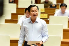 Phó Thủ tướng Lê Minh Khái làm rõ vai trò của Chính phủ trong việc quản lý và điều tiết lĩnh vực ngân hàng, tiền tệ. (Ảnh: Minh Đức/TTXVN)