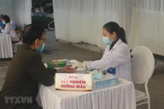 Khu vực lấy máu xét nghiệm đường huyết. (Ảnh: Khiếu Tư/TTXVN)