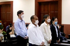 Các bị cáo nghe tuyên án phúc thẩm. (Ảnh: Thành Chung/TTXVN)