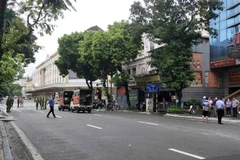 Hiện trường vụ án được lực lượng chức năng phong tỏa để phục vụ điều tra. (Ảnh: TTXVN phát)