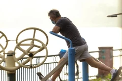 Người dân tập thể dục buổi sáng. (Nguồn: TTXVN)