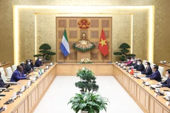 Thủ tướng Phạm Minh Chính hội kiến Tổng thống Cộng hòa Sierra Leone Julius Maada Bio. (Ảnh: Dương Giang/TTXVN)