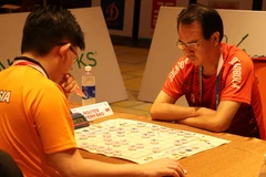 Tuyển thủ Nguyễn Thành Bảo thi đấu nội dung đồng đội nam cờ nhanh. (Ảnh: Hoàng Ngọc/TTXVN)