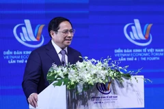 Thủ tướng Phạm Minh Chính phát biểu tại Diễn đàn Kinh tế Việt Nam lần thứ tư. (Ảnh: Dương Giang/TTXVN)