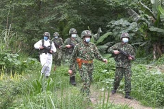 Lực lượng biên phòng hai nước Việt Nam, Trung Quốc phối hợp tuần tra biên giới. (Ảnh: TTXVN phát)