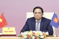 Thủ tướng Phạm Minh Chính dự Phiên toàn thể Hội nghị Thượng đỉnh Lãnh đạo nữ ASEAN lần thứ 2 tại điểm cầu Hà Nội. (Ảnh: Dương Giang/TTXVN)