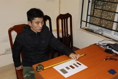 Đối tượng Nguyễn Trung Huyên tại cơ quan Công an. (Ảnh: TTXVN phát)