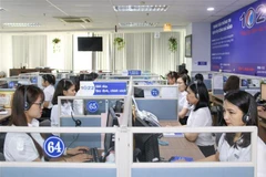 Tổng đài 1022 Đà Nẵng tiếp nhận và xử lý thông tin của người dân, doanh nghiệp. (Ảnh: TTXVN)