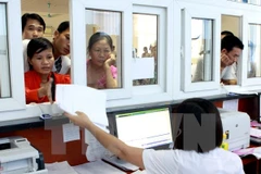 Thủ tục bảo hiểm y tế hộ gia đình đã được cắt giảm. (Ảnh minh họa: TTXVN)