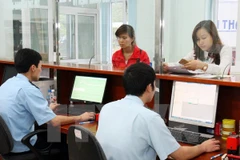 Tốc độ thực hiện hệ thống quản lý văn bản điện tử giữa các cơ quan không đồng đều. (Ảnh minh họa: TTXVN)