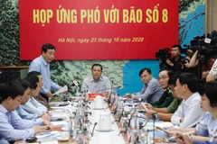Ông Trần Quang Hoài, Phó trưởng Ban Chỉ đạo Trung ương về phòng, chống thiên tai, Tổng cục trưởng Tổng cục Phòng, chống thiên tai báo cáo tình hình diễn biến của bão số 8. (Ảnh: Trần Việt/TTXVN)