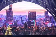 Tiết mục hòa tấu "Thành phố Hồ Chí Minh - Khúc khải hoàn". (Ảnh: Thu Hương/TTXVN)