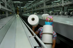  Sản xuất sợi tại Công ty Cổ phần Đồng Phát (Hà Nội). (Ảnh: Danh Lam/TTXVN)