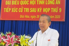 Phó Thủ tướng Trương Hòa Bình phát biểu tại buổi tiếp xúc cử tri huyện Đức Hòa (Long An). (Ảnh: Bùi Giang/TTXVN)