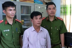 Đối tượng Dương Minh Hiến bị bắt giữ. (Ảnh: Võ Dung/TTXVN)