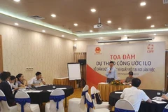 Tọa đàm Dự thảo Công ước của ILO về chấm dứt bạo lực và quấy rối trong công việc. (Ảnh: PV/Vietnam+)