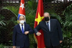Chủ tịch nước Nguyễn Xuân Phúc hội kiến Thủ tướng Cuba Manuel Marrero Cruz trong chuyến thăm chính thức Cộng hòa Cuba, sáng 19/9/2021 tại thủ đô La Habana. (Ảnh: Thống Nhất/TTXVN)