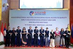 Các đại biểu chụp ảnh lưu niệm tại Hội nghị. (Ảnh: Phạm Kiên/TTXVN)