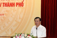 Bộ trưởng Bộ Tài chính Đinh Tiến Dũng phát biểu. (Ảnh: Phạm Hậu/TTXVN)