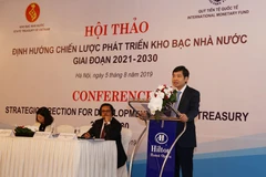 Tổng giám đốc Kho bạc Nhà nước Tạ Anh Tuấn phát biểu khai mạc hội thảo. (Ảnh: Phạm Hậu/TTXVN)