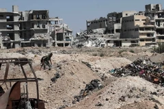 Nhà cửa bị phá hủy tại thành phố Aleppo, miền bắc Syria ngày 12/9. (Nguồn: THX/TTXVN)